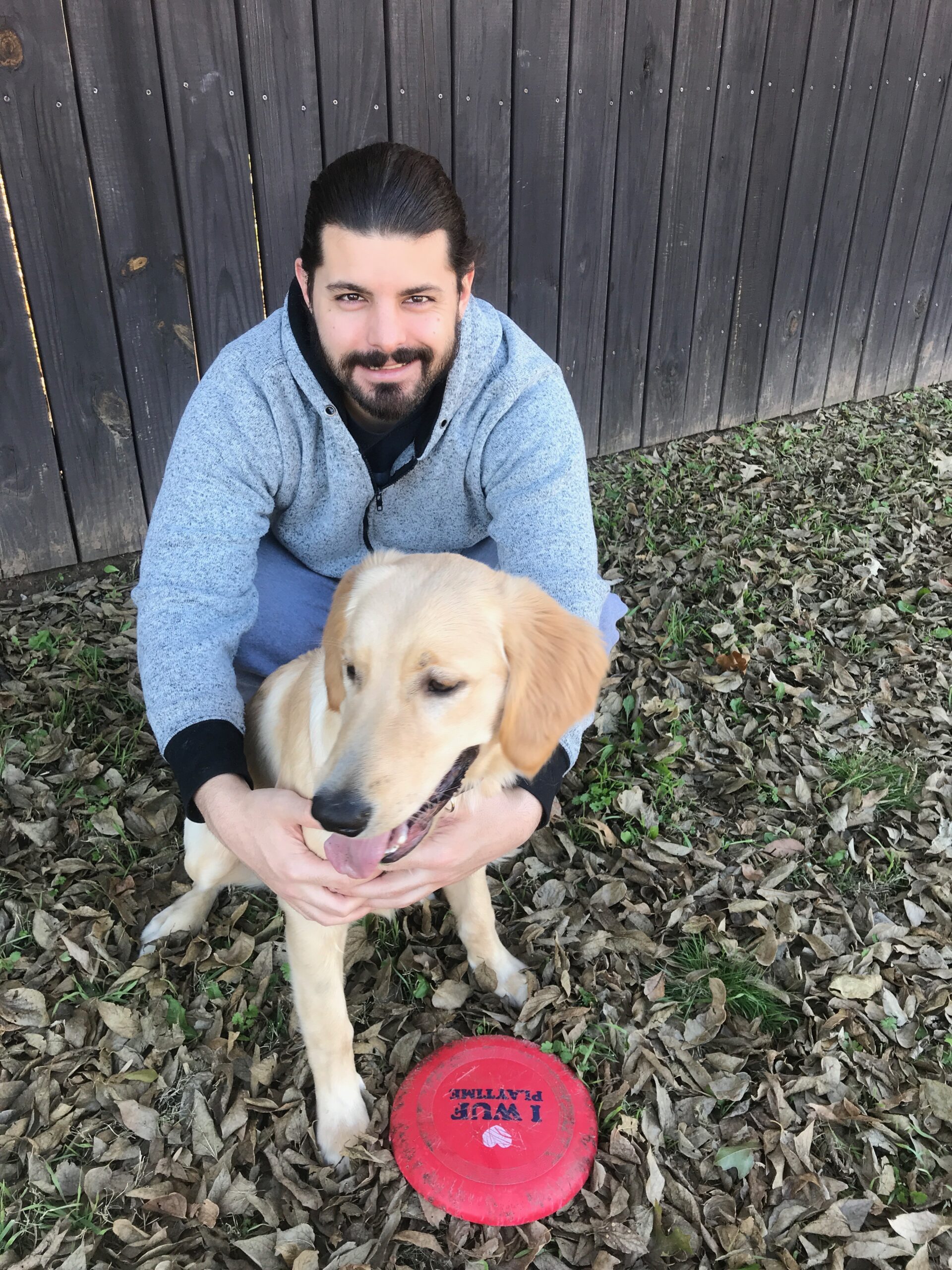 New trainer holding a dog