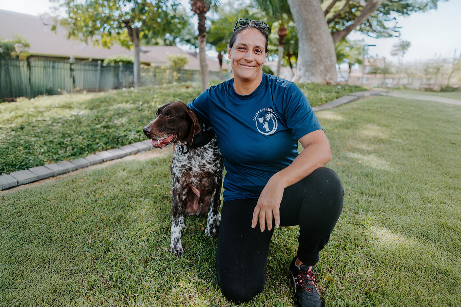 Maria training her dog at the park